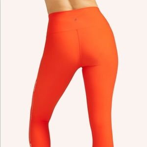 Brand new peloton orange leggings size small